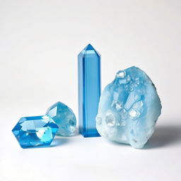 Blue Topaz crystals in both polished and raw forms displayed gracefully on a bright white backdrop