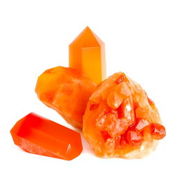 Carnelian crystals in both polished and raw forms displayed gracefully on a bright white backdrop