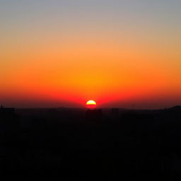 A breathtaking sunset in Lima, with the sun dipping below the horizon and painting the sky in vibrant shades of orange