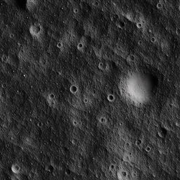 A detailed landscape of the moon surface with sharp craters, lunar dust and dimly lit shadows.