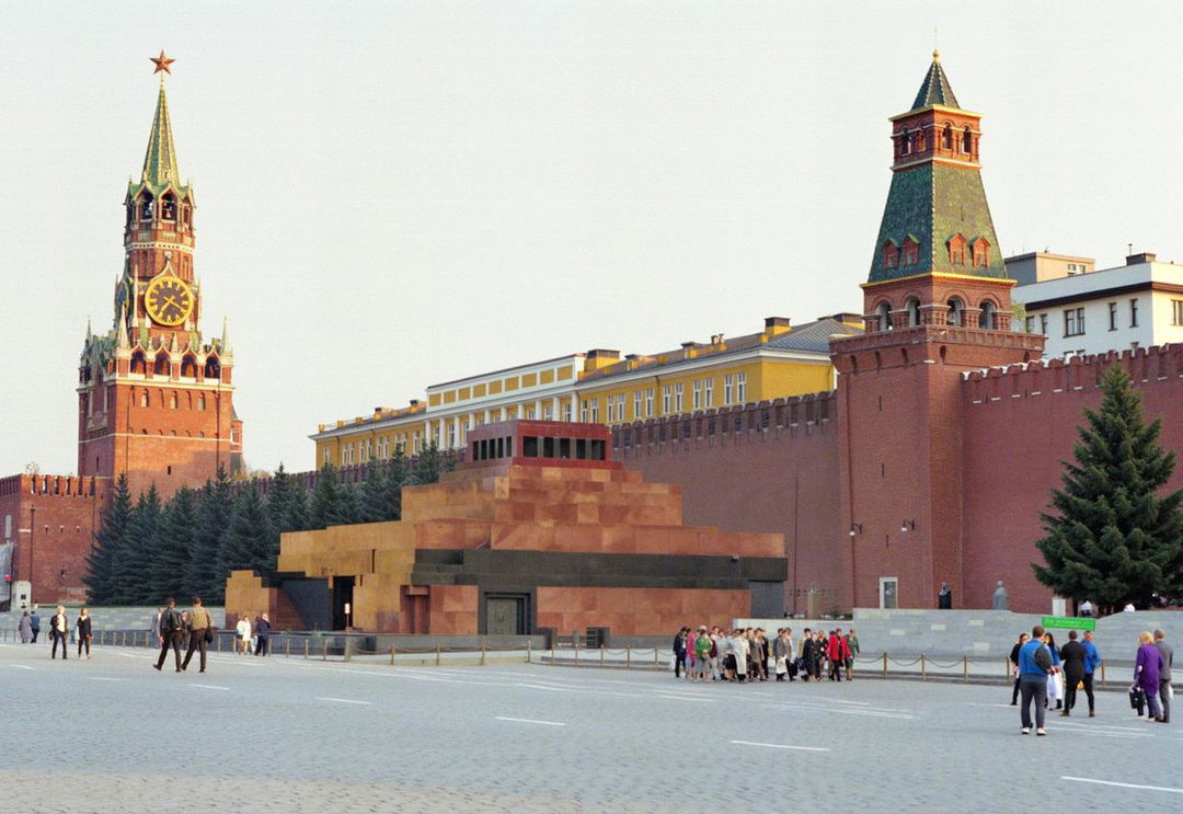 A view of Lenin's Mausoleum in Red Square, Moscow, with a large queue of people waiting outside