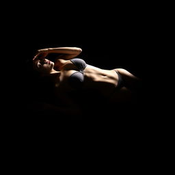 A young woman in a bikini, lying on her back sideways in a completely dark space