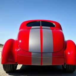 A 1939 Chevrolet Coupe in a striking cherry red color with gray stripes