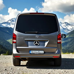 A luxurious Mercedes V-Class minivan parked majestically in a serene mountainous location