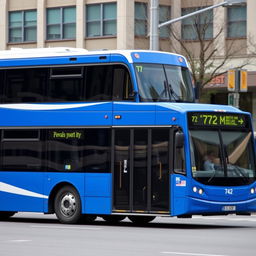 A city articulated bus with a blue color scheme, featuring white curved lines on the sides of the roof