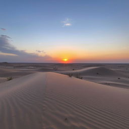 A vast grey desert landscape at sunset with the horizon bathed in soft orange and pink hues