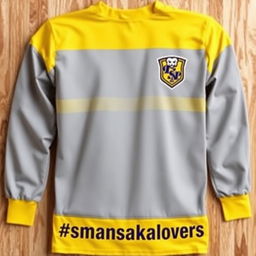 A long-sleeve sports jersey featuring a mix of yellow and gray colors