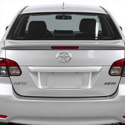 A silver Toyota Corolla AE102, showcasing a subtle yet stylish ducktail spoiler mounted on the trunk