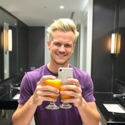 A man taking a selfie in a bathroom, smiling and holding a glass of orange juice