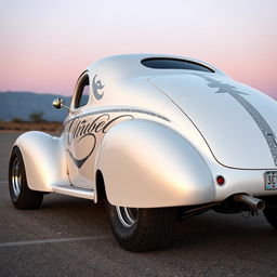 Speed-inspired widebody 1939 Chevrolet Coupe transformed into a ratrod, featuring a striking pearl white exterior with bold silver stripes embellished with shimmering silver specks