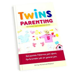 A colorful and engaging book cover for the title "Twins Parenting: Dari A sampai Z seputar Anak Kembar" (Twins Parenting from A to Z about Twin Children), authored by Muhamad Masruri