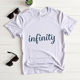 A flat lay image of a simple, classic plain t-shirt designed with the word 'infinity' artistically printed on it