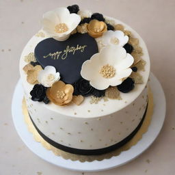 Bento cake styled with an elegant palette of blacks, whites, and golds. Decorations include two hearts piped side by side in the center, sprinkled with glitter. Surrounding the hearts are delicate buttercream flowers. 'Happy Anniversary & Happy Birthday Hon' encircles the edge in cursive. Small golden piped dots or stars add the final glamourous touch.