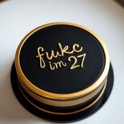 A beautifully crafted bento-style cake, featuring a sleek black exterior with a luxurious gold trim circling the cake