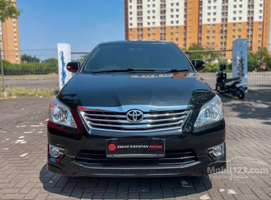 A front view of a full black Toyota Innova, showcasing its sleek and modern design