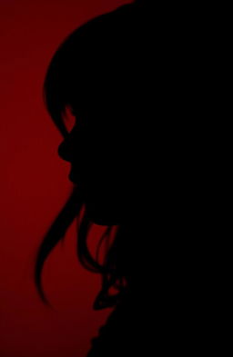 A close-up silhouette profile of a girl gently whispering, with her lips slightly parted