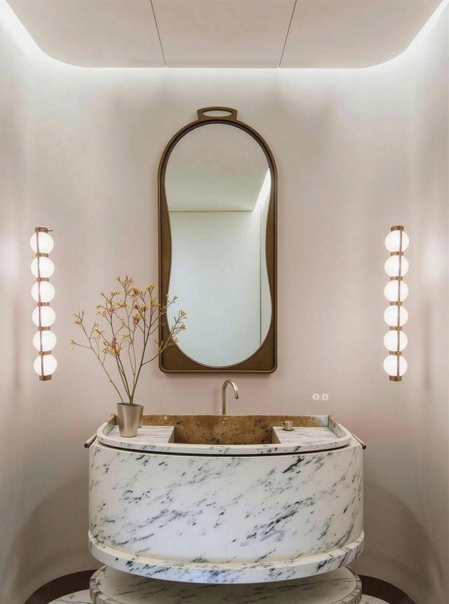 A sophisticated bathroom interior featuring a round-light design above a stylish oval marble sink