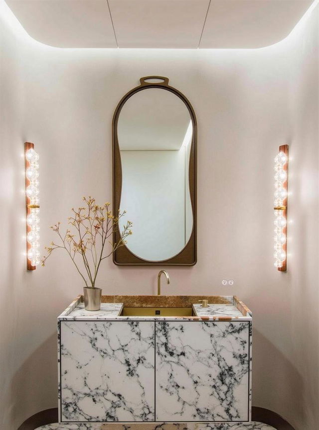 A sophisticated bathroom setup featuring a stylish vanity with a luxurious marble countertop