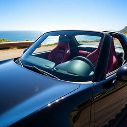 A sleek black Mazda MX-5 ND sports car, featuring luxurious wine-colored leather seats