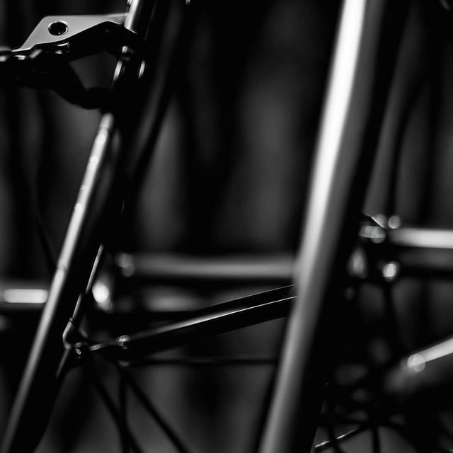 Close-up shot of a minimalist bicycle in a product editorial style.