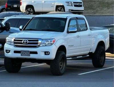 A front view of a 2002 Toyota Land Cruiser 100, showcasing its robust and iconic design