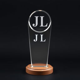 A crystal acrylic trophy with the letters 'J L' engraved on it, placed on a circular wooden base