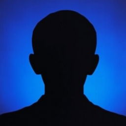 A silhouette of a person's head viewed from behind, featuring a distinctive key-shaped hole located at the back of the head