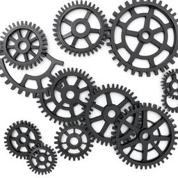 Multiple black 3D gear wheels, varying in size and intricately designed, arranged aesthetically against a clean white background