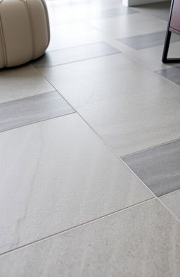 A close-up view of stylish and modern tiles that imitate the look of cement, showcasing a seamless layout of these tiles on a floor