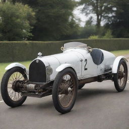 An early twentieth-century Le Mans racing car, exemplifying the pioneering spirit of early motor racing. The car features a narrow, leggy body, a large exposed radiator, thin tires on large wooden spoke wheels, and a minimalist cockpit