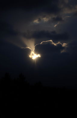 A serene and ethereal scene depicting a soft, warm light breaking through dense, dark clouds, casting a gentle glow on the surrounding landscape