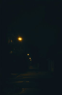 A moody urban landscape at night, featuring a quiet street illuminated by soft glowing street lights