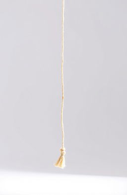 A visually striking image of a broken string isolated on a clean, white background