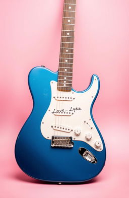 A vintage blue electric guitar elegantly positioned against a soft pink background, accompanied by a handwritten letter that reads "Love, Lydie