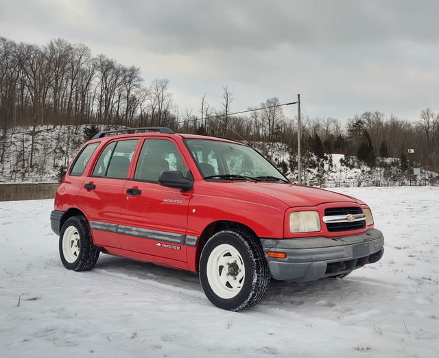 Transform a red compact SUV into a World Rally Championship (WRC) car