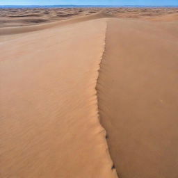 A vast, arid desert under a clear blue sky. Scattered sand dunes, shaped by the wind, create a beautiful pattern against the horizon.