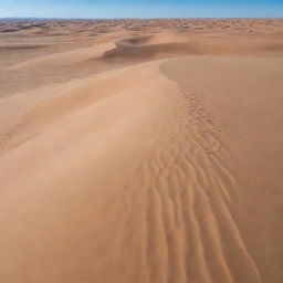 A vast, arid desert under a clear blue sky. Scattered sand dunes, shaped by the wind, create a beautiful pattern against the horizon.