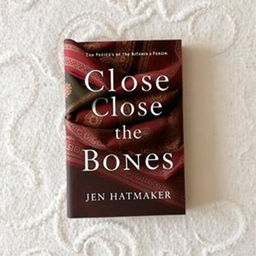 A captivating book cover design for 'Close the Bones' by Jen Hatmaker, featuring a stunning rebozo that elegantly wraps around the cover