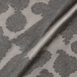 A piece of luxurious silk fabric featuring an intricate pattern of black linear drawings