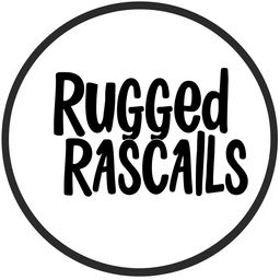 A circular design featuring the text 'Rugged Rascals' styled in a beach-style font