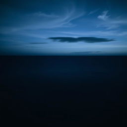 An expansive ocean scene at night, where the ocean stretches to the horizon with no beach visible at the bottom, creating a continuous body of water