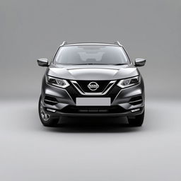 A front-facing view of a sleek Nissan Qashqai with a modern grey finish, featuring stylish silver alloy wheels