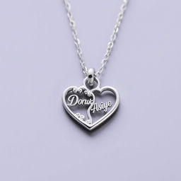 A delicate heart-shaped necklace with the inscription 'Doruk' on one side and 'Asiye' on the other