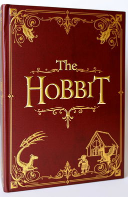 A beautifully designed book cover for 'The Hobbit' featuring an old-style aesthetic