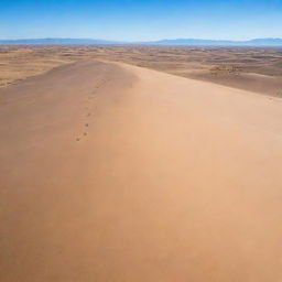 A vast, arid desert with rolling sand dunes under a clear, blue sky