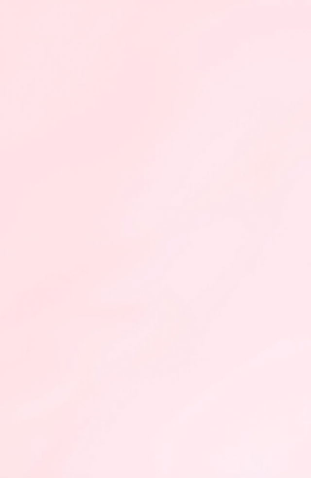 A simple, soft pink background with a smooth texture, evoking a calming and serene atmosphere