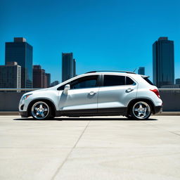 A lowered white 2012 Chevy Trax parked in a modern urban environment