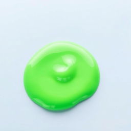 A small, completely still puddle of bright green slime with a smooth texture, on a flat surface