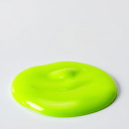 A small, completely still puddle of bright green slime with a smooth texture, on a flat surface