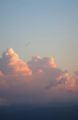 A dreamy landscape with fluffy, soft clouds in a pastel sky, illuminated by the warm glow of the sun setting on the horizon